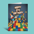 An 8th birthday greeting card featuring a Lego-themed design with the text 'HAPPY 8TH BIRTHDAY' on a light blue background.