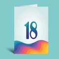 An 18th birthday greeting card shown standing upright on a light blue background. The card has a white background with a large stylized number 18 in blue and purple, and a colorful wavy gradient design in shades of pink, orange, yellow, green, and blue at the bottom.