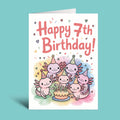 A folded greeting card standing upright on a light aqua background. The card has a white base with the text 'Happy 7th Birthday!' in coral pink lettering and a colorful illustration of five cute pink axolotl-like characters wearing party hats around a birthday cake.