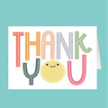 Colorful 'THANK YOU' card with a smiley face on a teal background