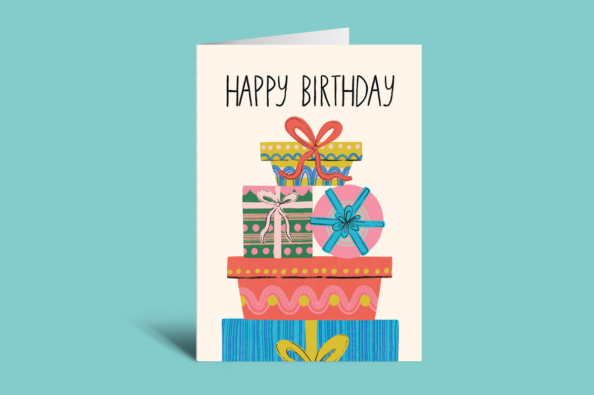 Birthday card with colorful gift boxes and 'Happy Birthday' text on a light blue background