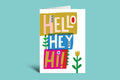 Colorful greeting card with 'Hello', 'Hey', and 'Hi!' text on a green background