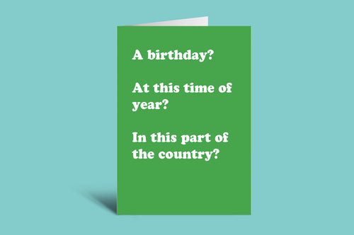 Green birthday card with humorous text on a teal background