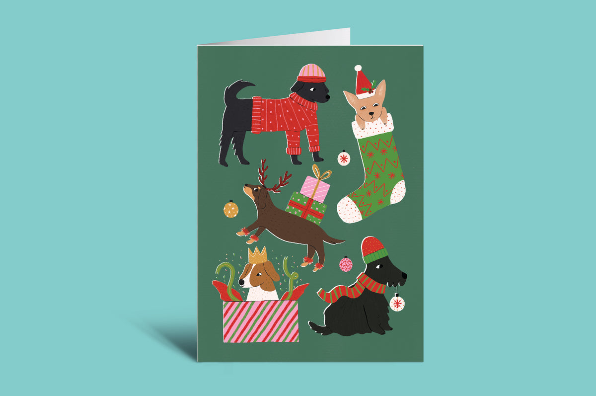 Greeting card with Christmas-themed illustrations of dogs on a green background