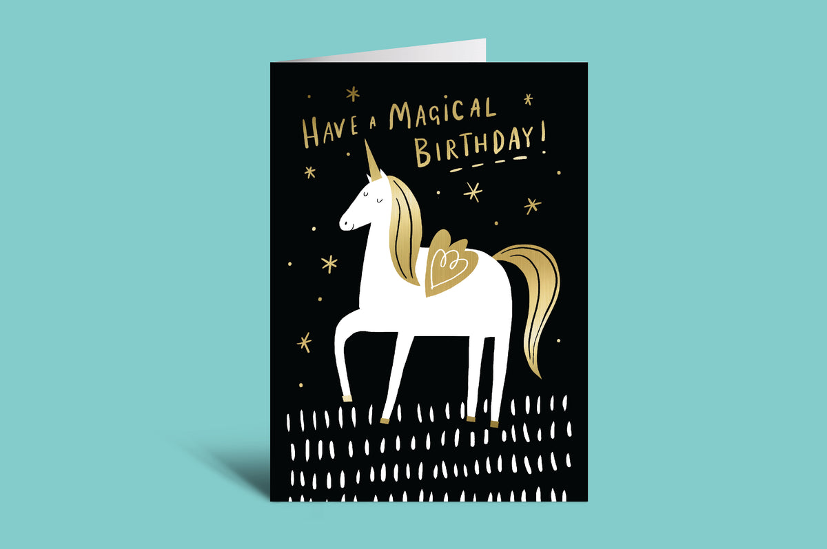 Greeting card with unicorn illustration and 'Have a Magical Birthday!' text on a teal background