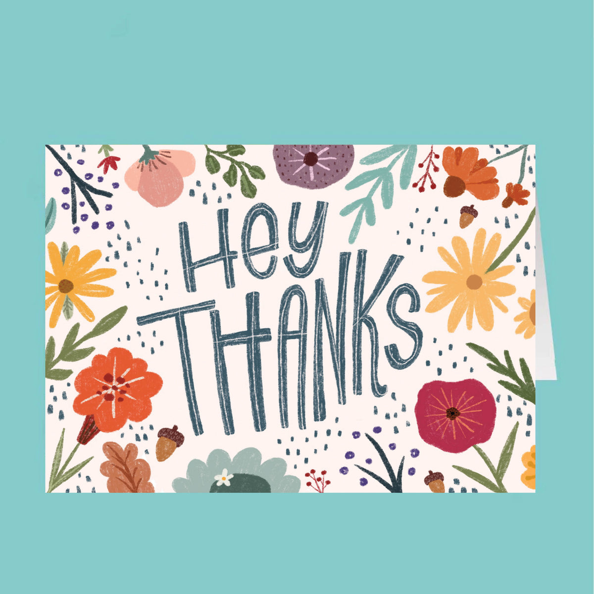 Card with 'Hey Thanks' text and floral design on a teal background