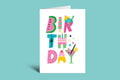 Colorful birthday-themed greeting card on a green background