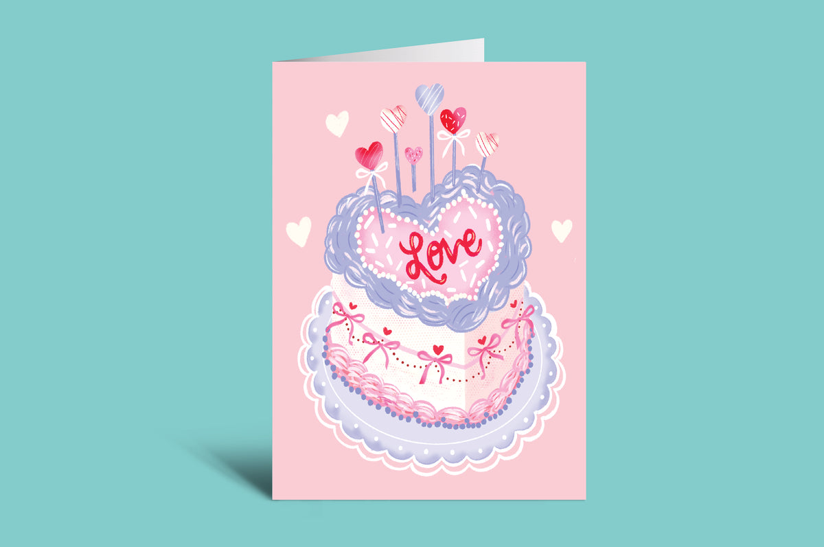 Greeting card with a cake design and 'Love' text on a pink background