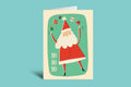 Christmas card with a cartoon Santa Claus on a green background