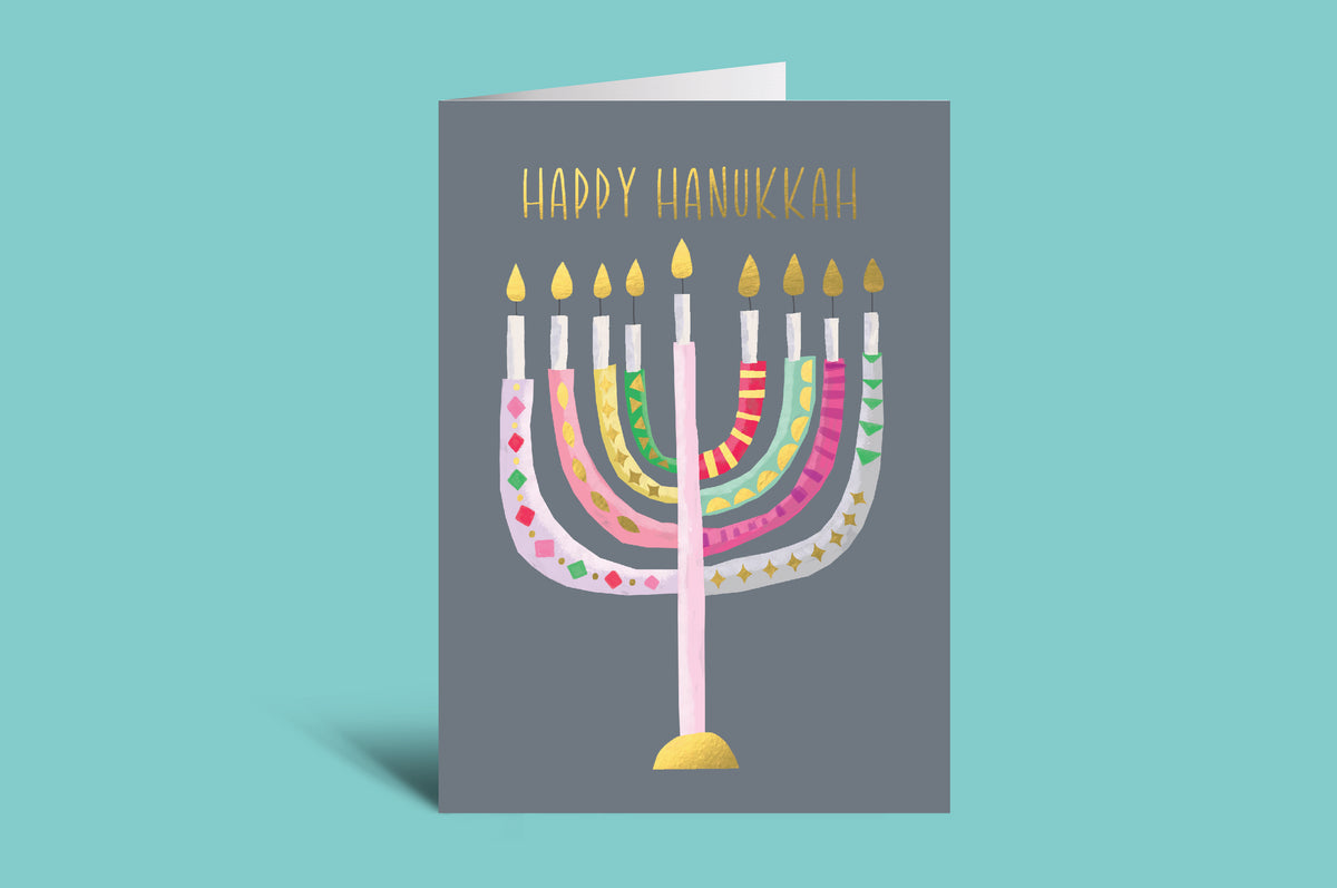Greeting card with colorful menorah design and 'Happy Hanukkah' text on a teal background