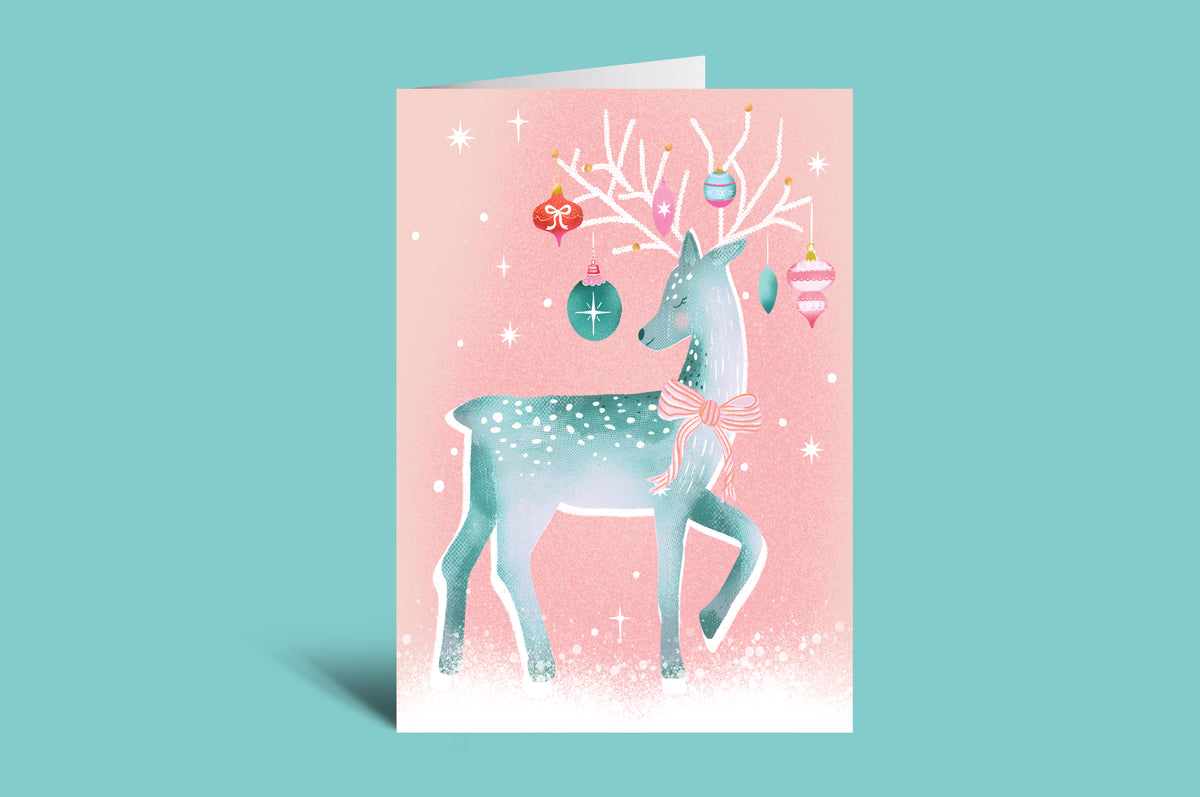 Card with a reindeer design on a pink background