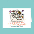 Card with floral design and 'Sending Love to Your New Home' text on a teal background