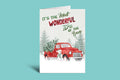 Christmas card with red truck and 'It's the Most Wonderful Time of the Year' text on a green background