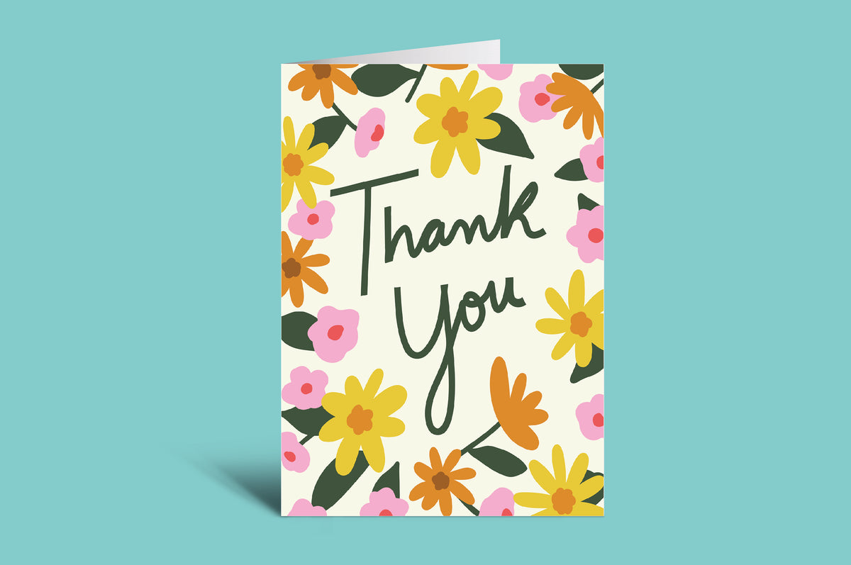 Greeting card with floral design and 'Thank You' text on a green background